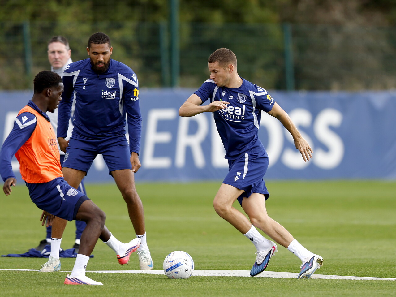 Conor Townsend on the ball during a training session, closely watched by Rabby Nzingoula 