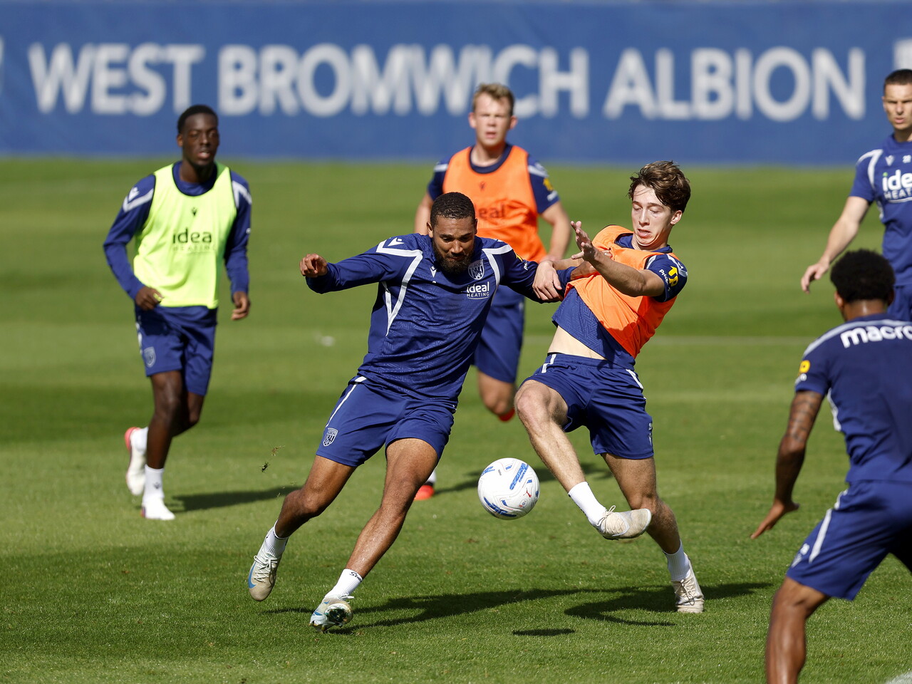 George Campbell and Harry Whitwell battling for the ball during a training session