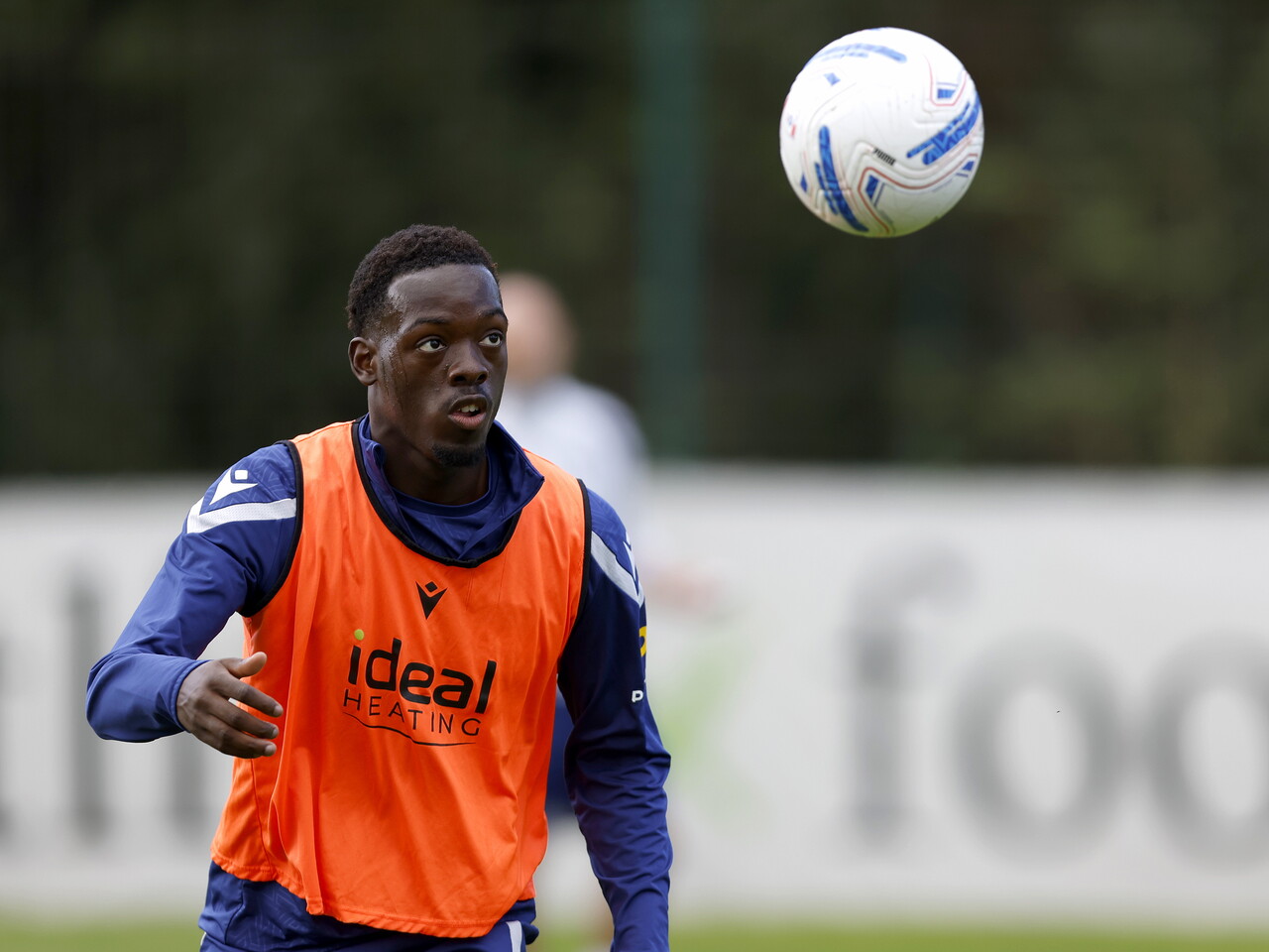 Rabby Nzingoula watching a ball in mid-air during training 