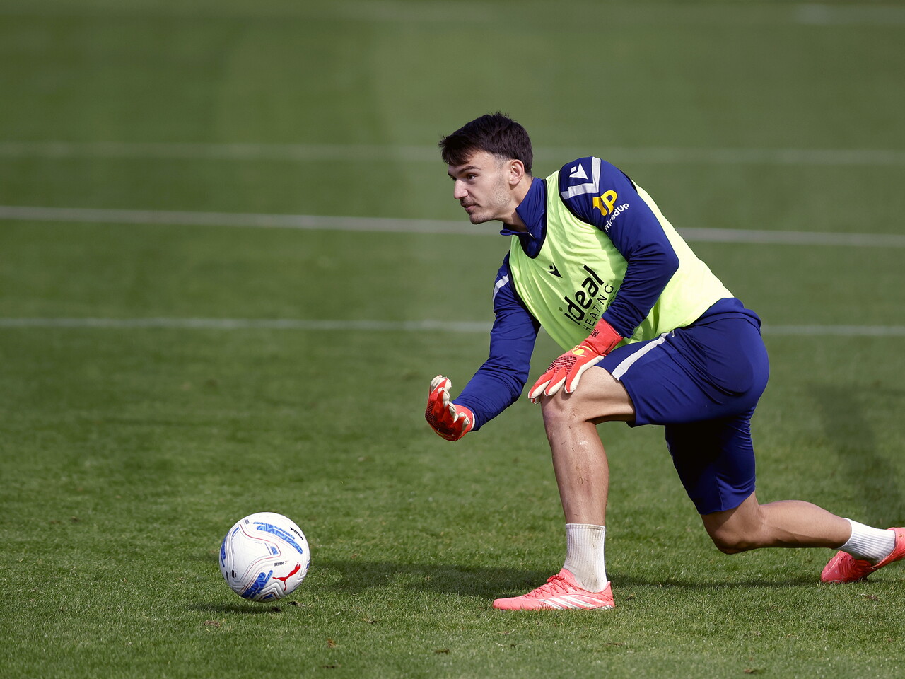 Max O'Leary rolling the ball out during a training session
