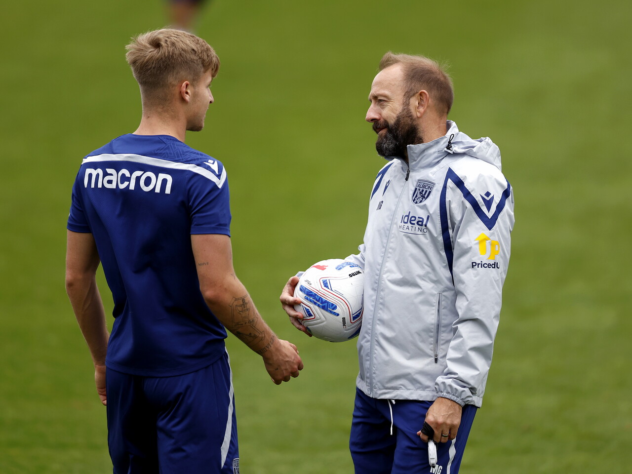 JJ Morgan chatting to Matt Gill during a training session