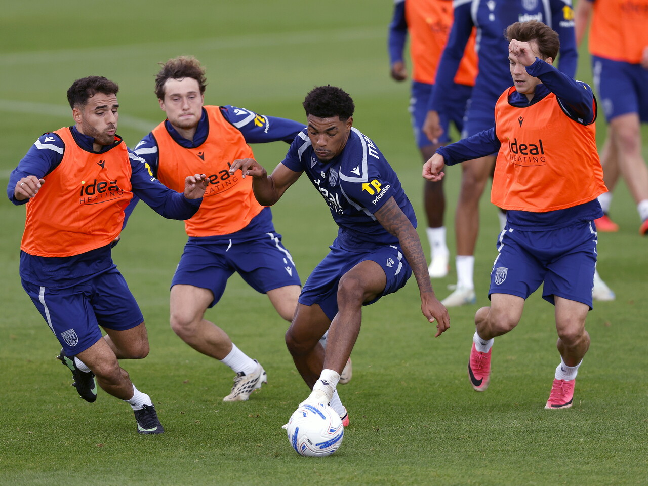 Kareem Tunde on the ball in training surrounded by three players