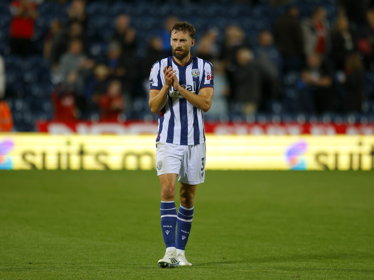 Nat Phillips applauding WBA fans after the full-time whistle against Charlton