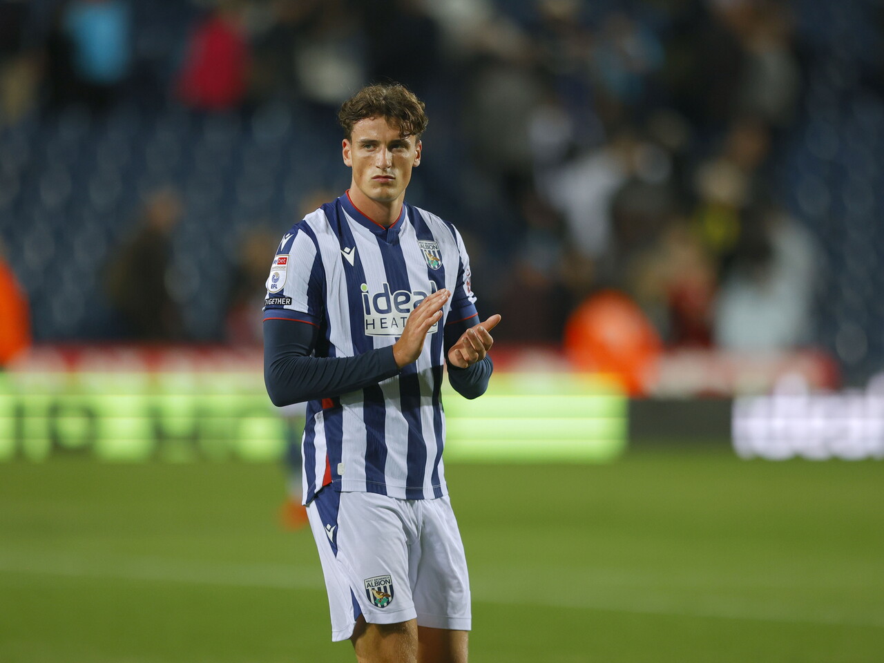 Barney Stewart applauding WBA fans after the full-time whistle against Charlton