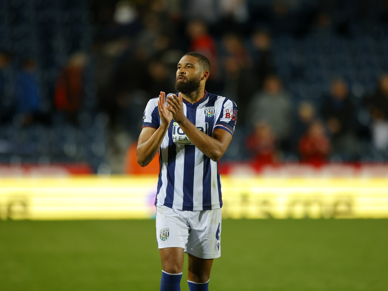 George Campbell applauding WBA fans after the full-time whistle against Charlton