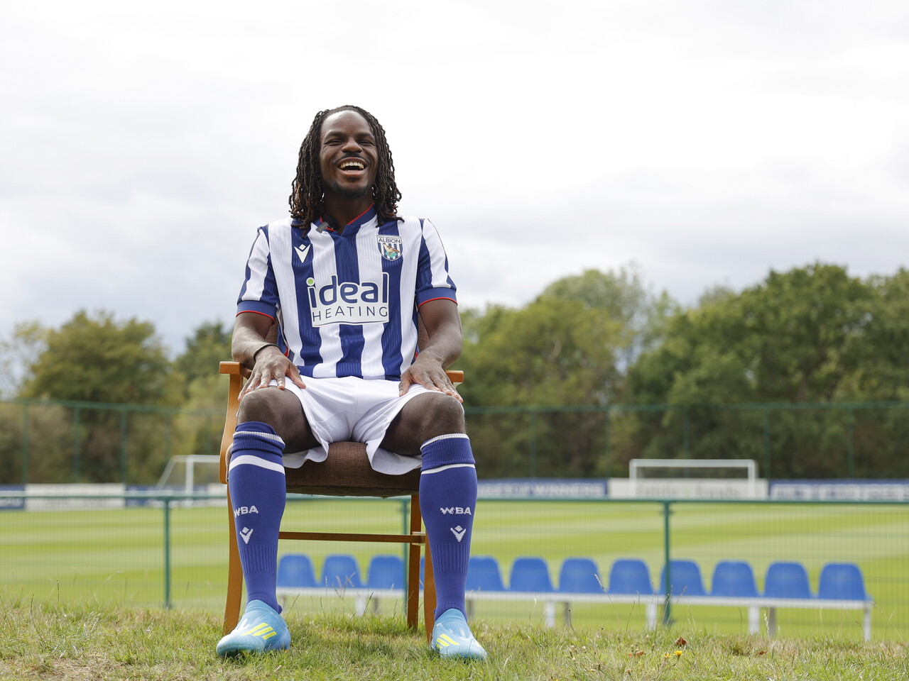 Brayann Pereira sat in a chair in the home kit while being interviewed by WBA TV