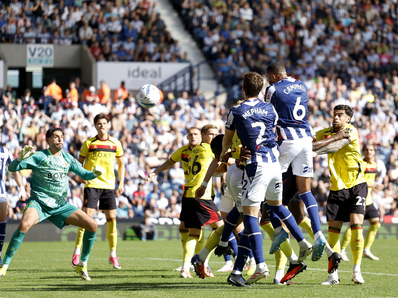 George Campbell heads the ball at goal against Watford