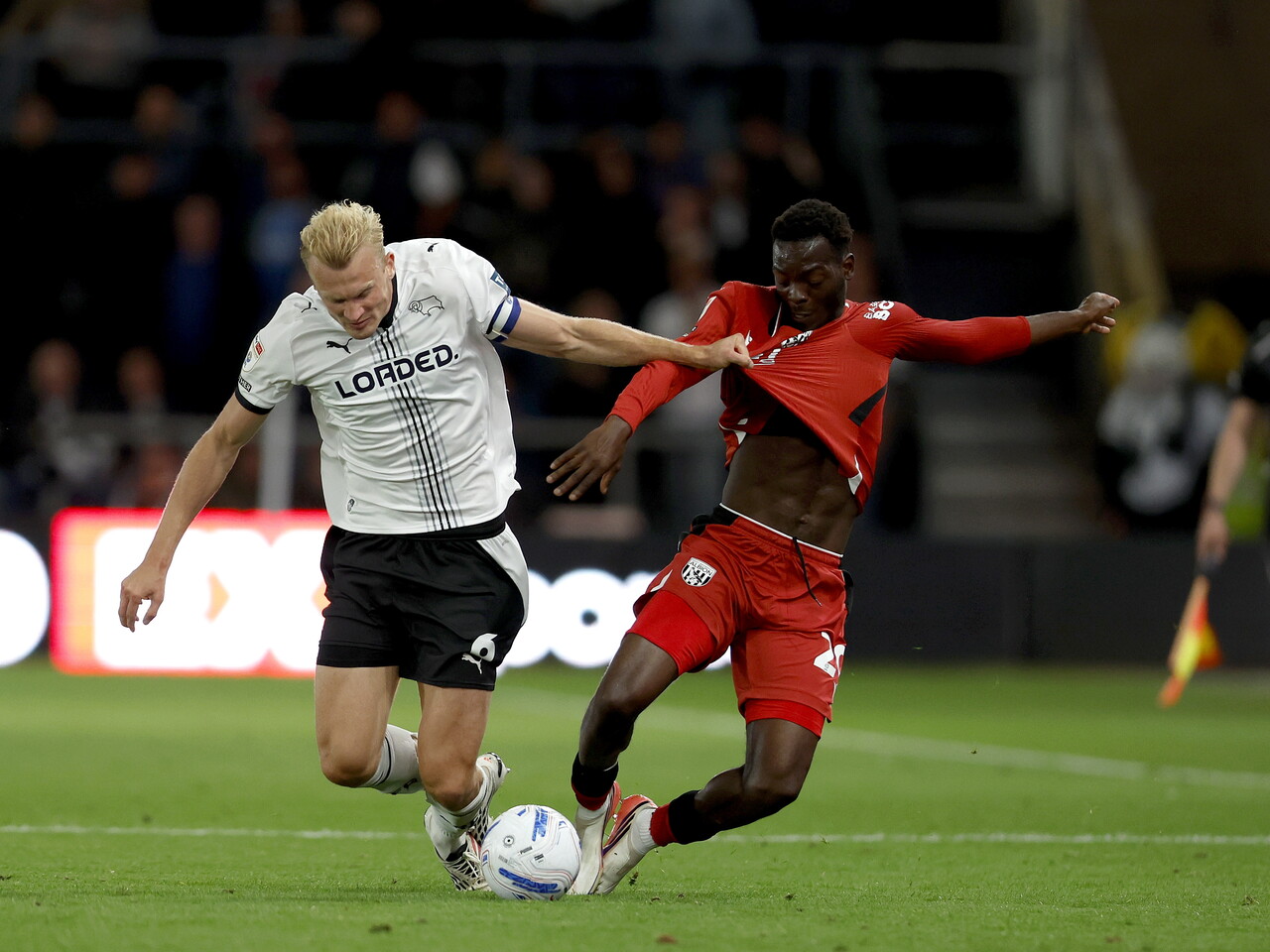 Rabby Nzingoula makes a tackle against Derby