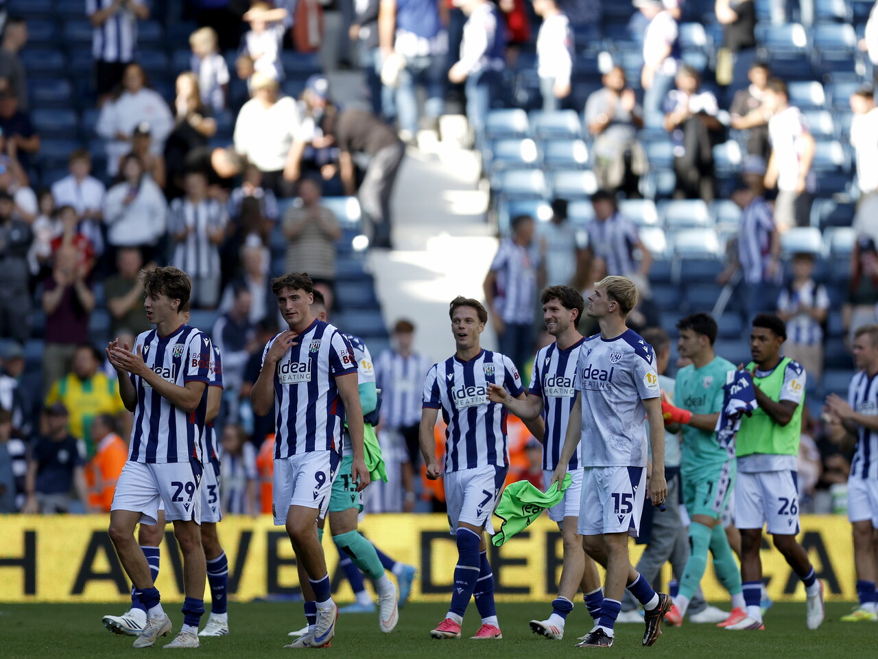 The team applaud the fans after Watford