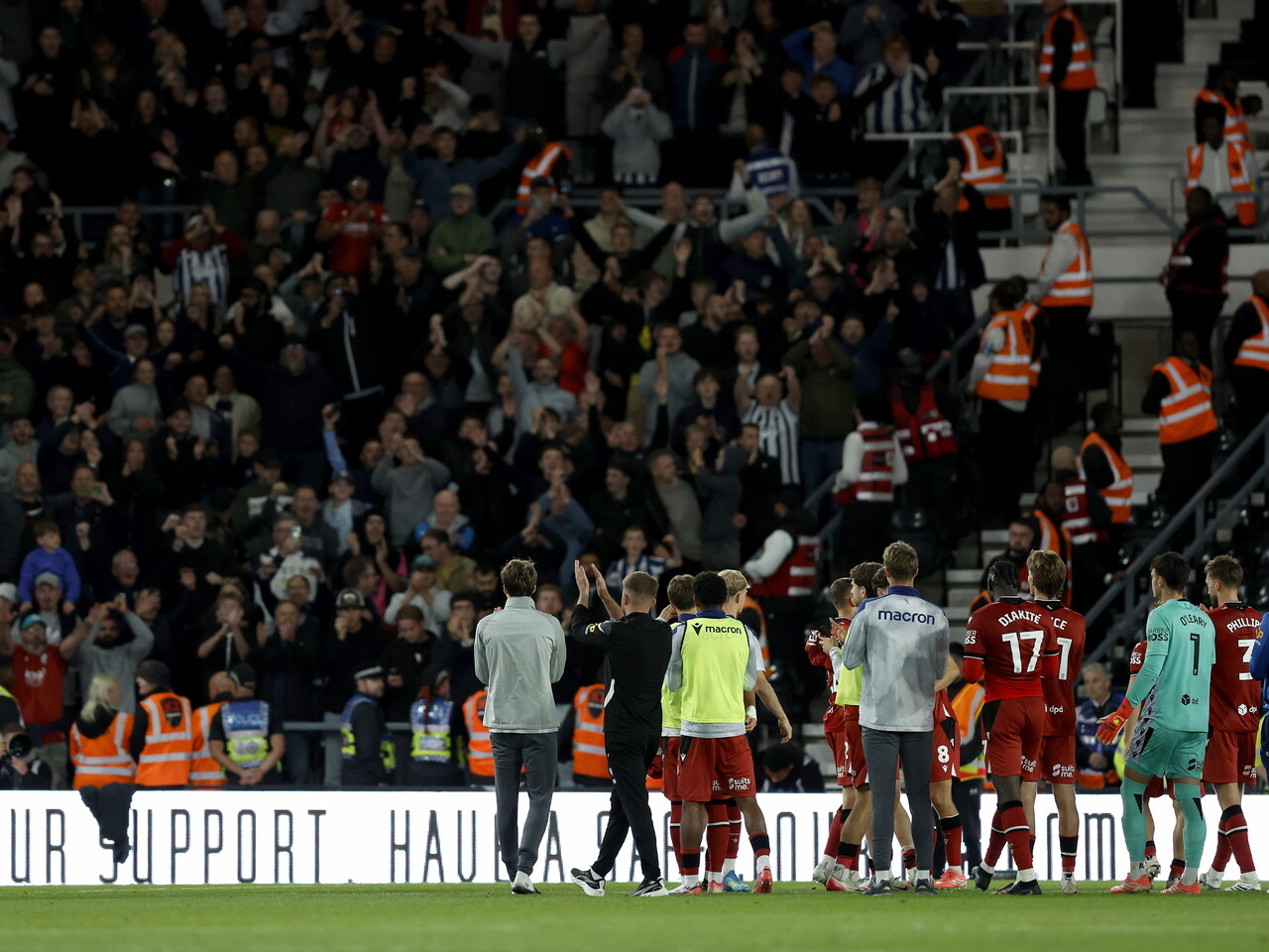 The team applaud the away fans at Derby