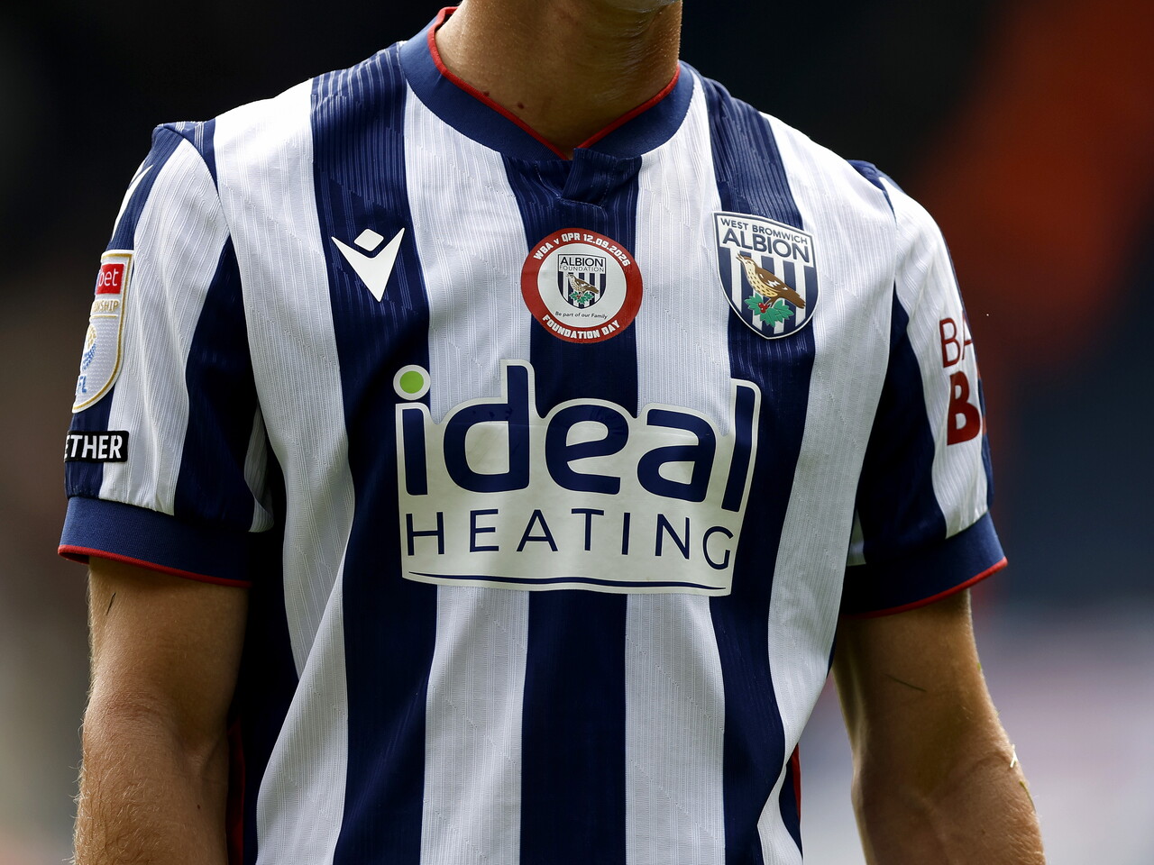 The Foundation Day badge on the front of a shirt
