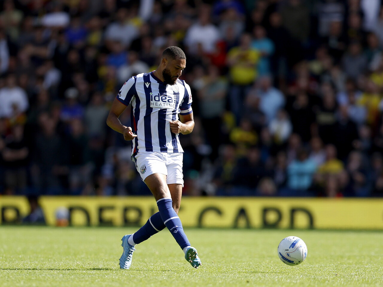 George Campbell passes the ball against Watford