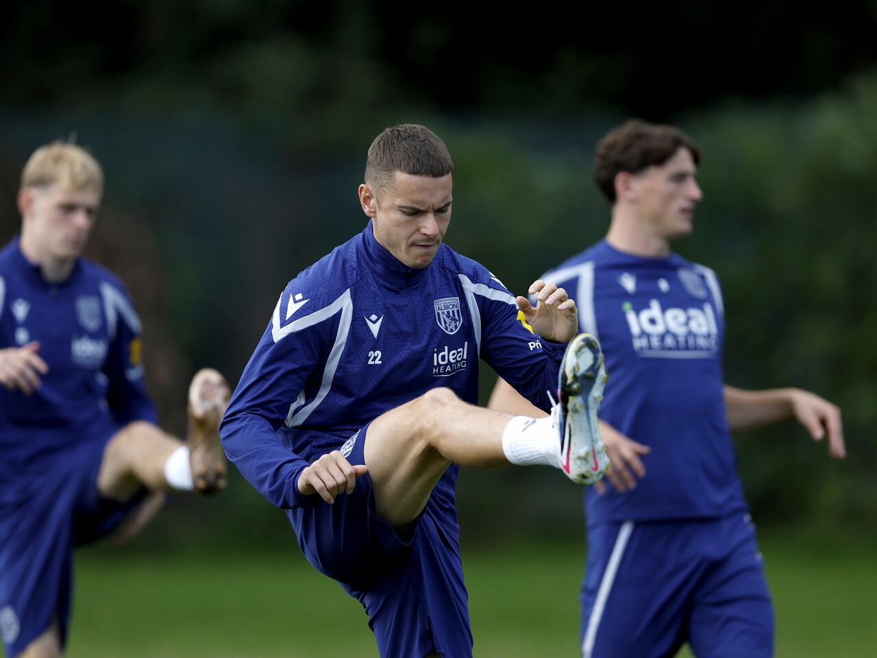 Conor Townsend stretching before a training session