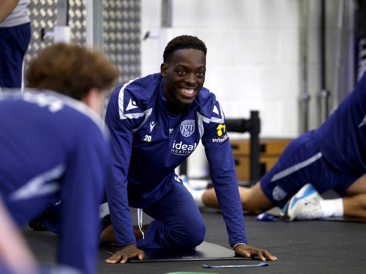 Rabby Nzingoula smiling in the gym