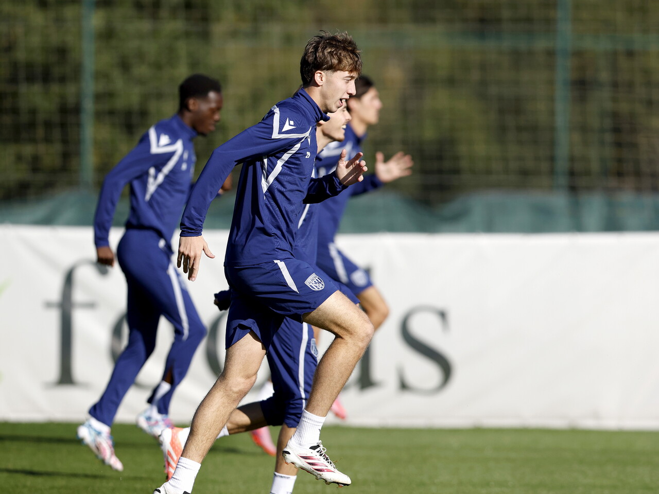 Harry Whitwell warming up before a training session