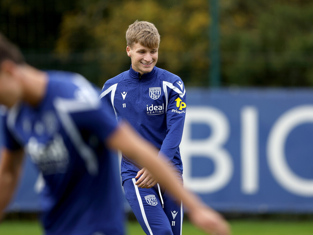 JJ Morgan smiling during a training session