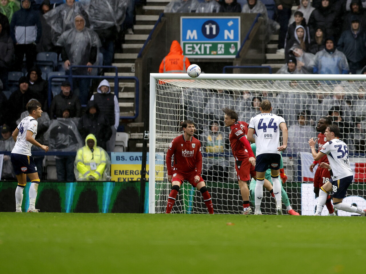 Callum Styles heads the ball clear against Preston