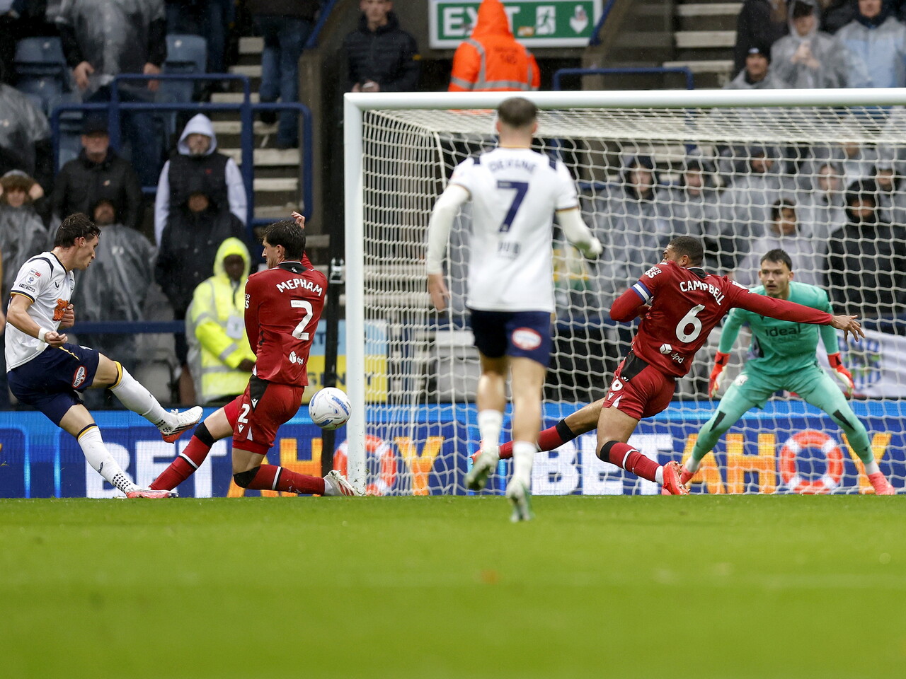 Chris Mepham makes a block against Preston