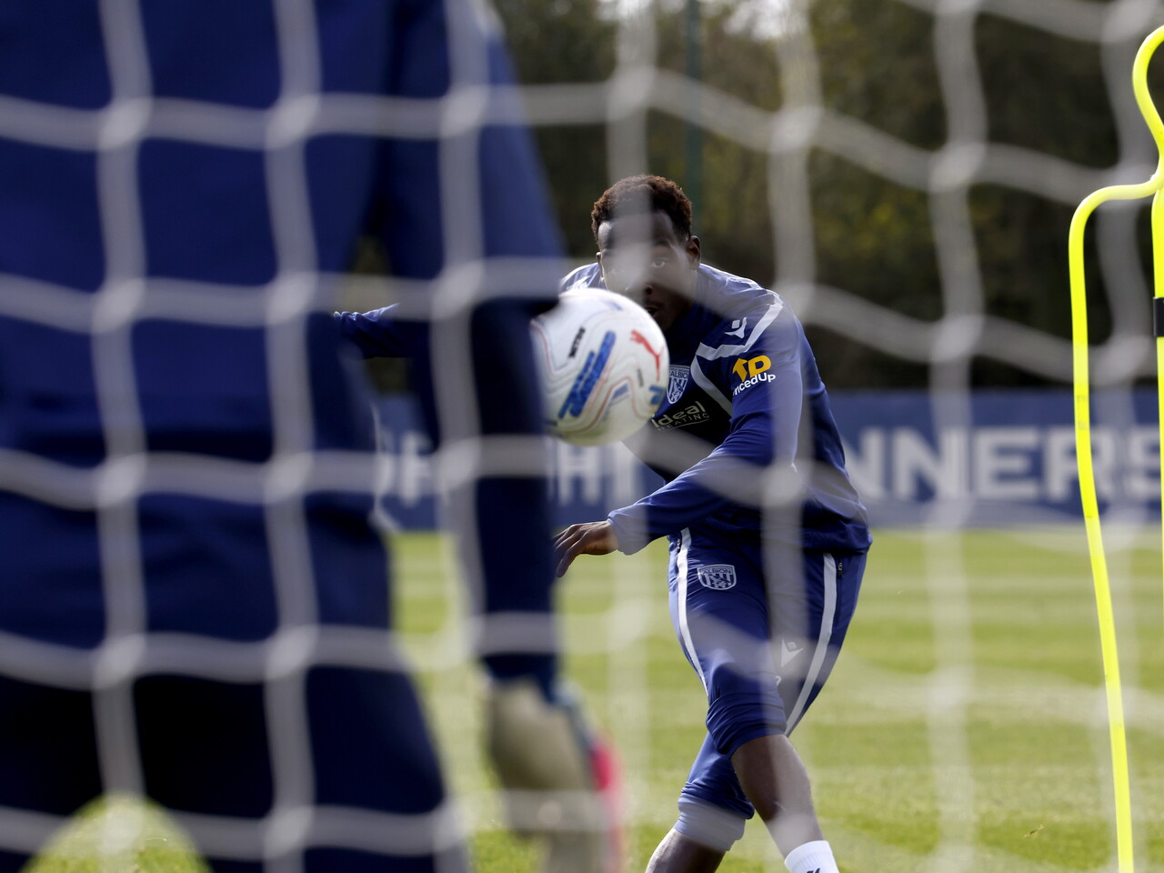 Rabby Nzingoula taking a shot during a training session