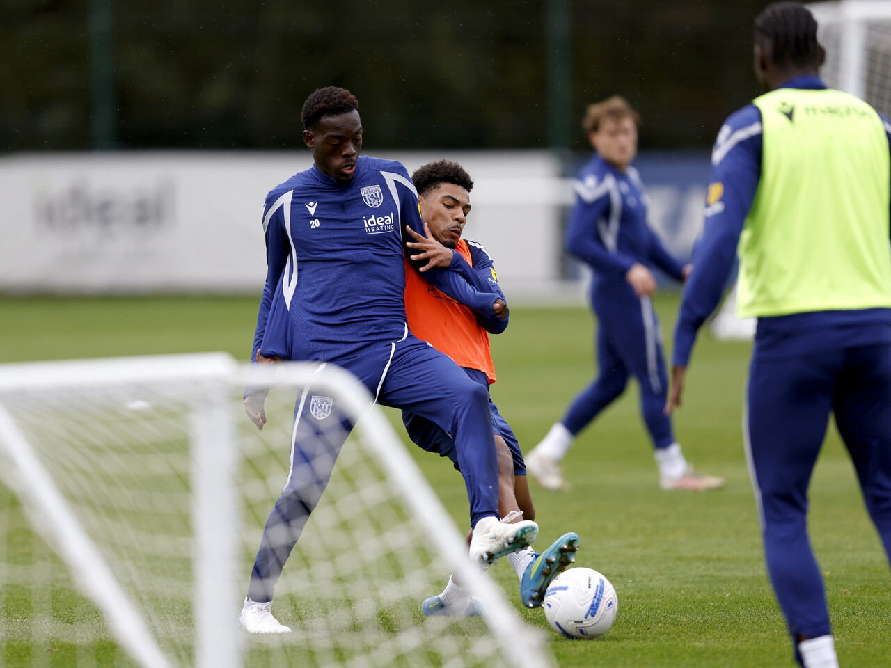 Rabby Nzingoula and Kareem Tunde fighting for the ball during training 
