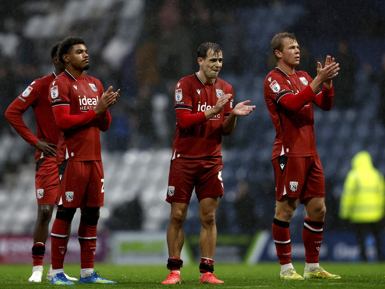 Jayson Molumby, Kareem Tunde and Aune Heggebo applaud the fans at full-time