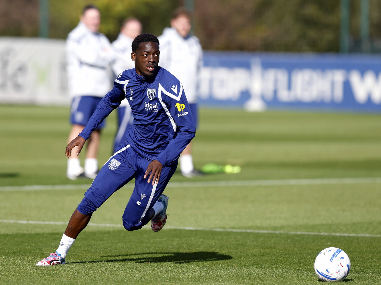 Rabby Nzingoula running with the ball during a training session