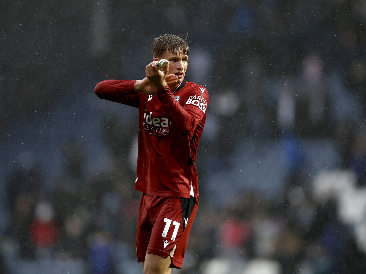 JJ Morgan applauds the fans at full-time