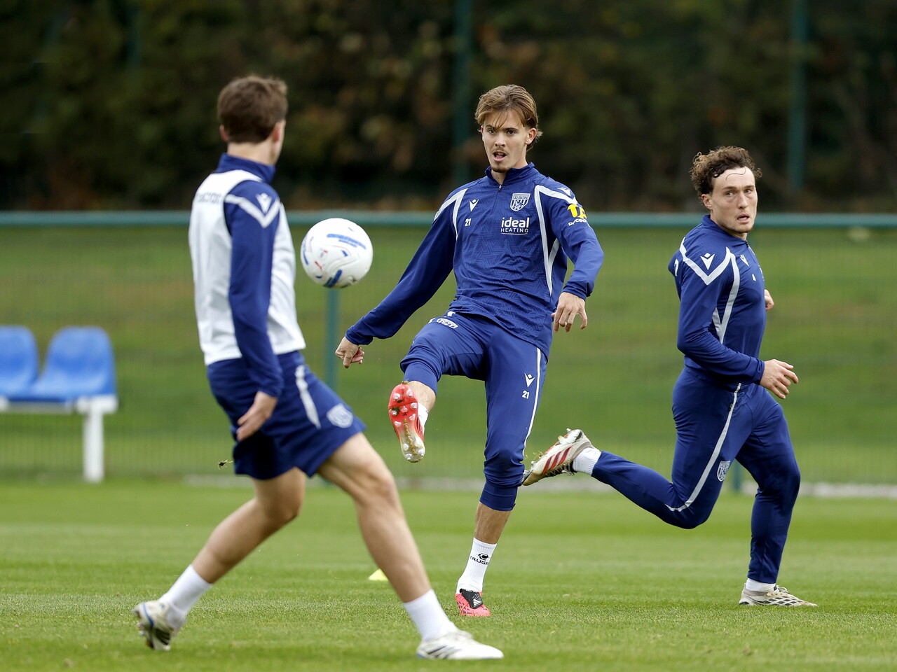 Isaac Price making a pass during training 