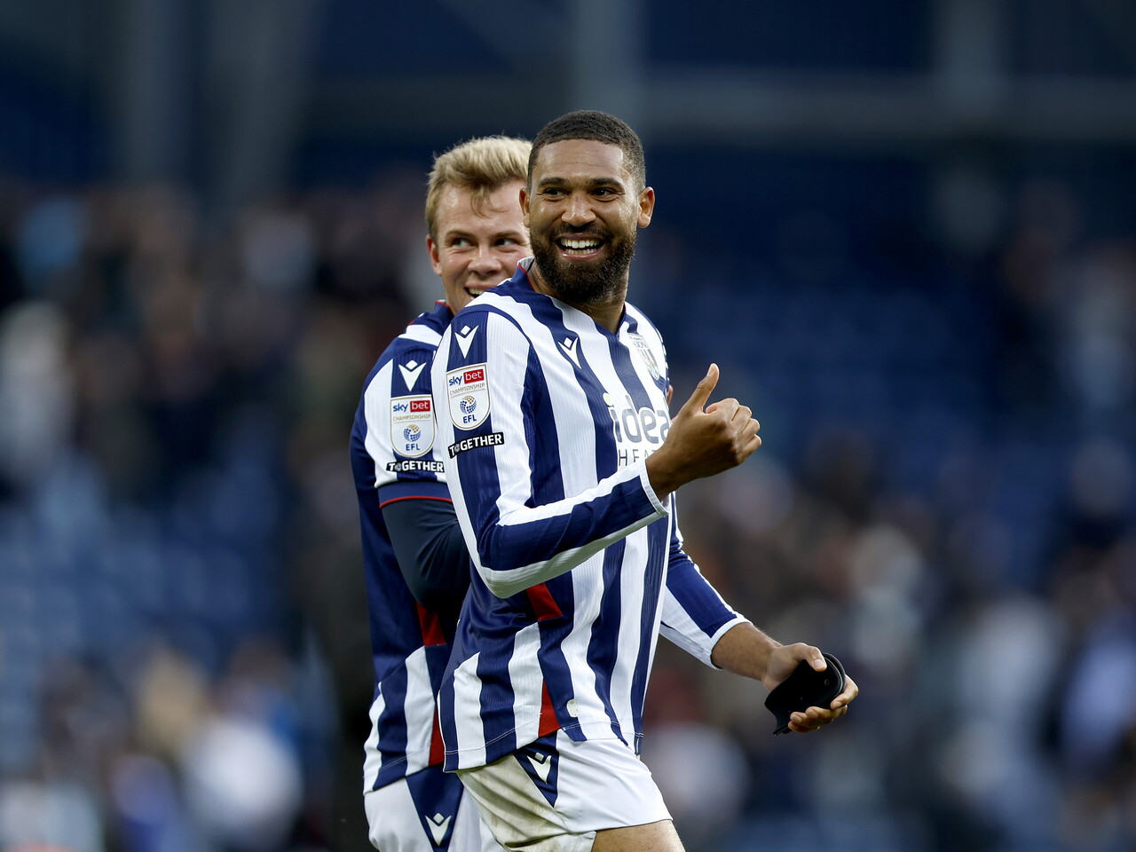 George Campbell applauds the fans at full-time