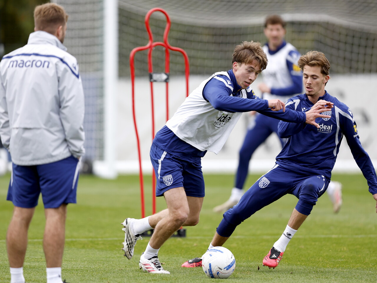 Harry Whitwell on the ball while Isaac Price defends during training 