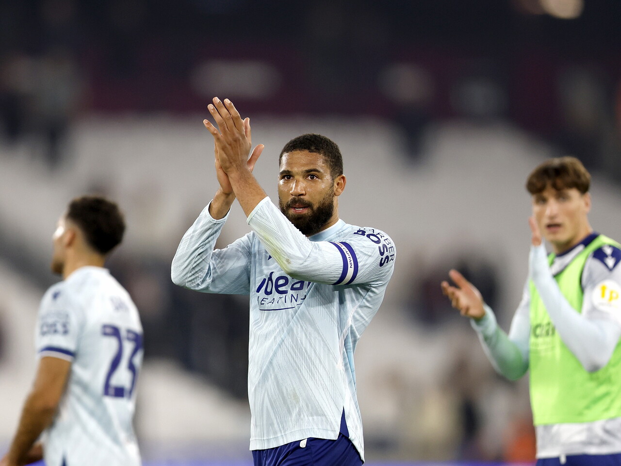 George Campbell applauds the fans at full-time