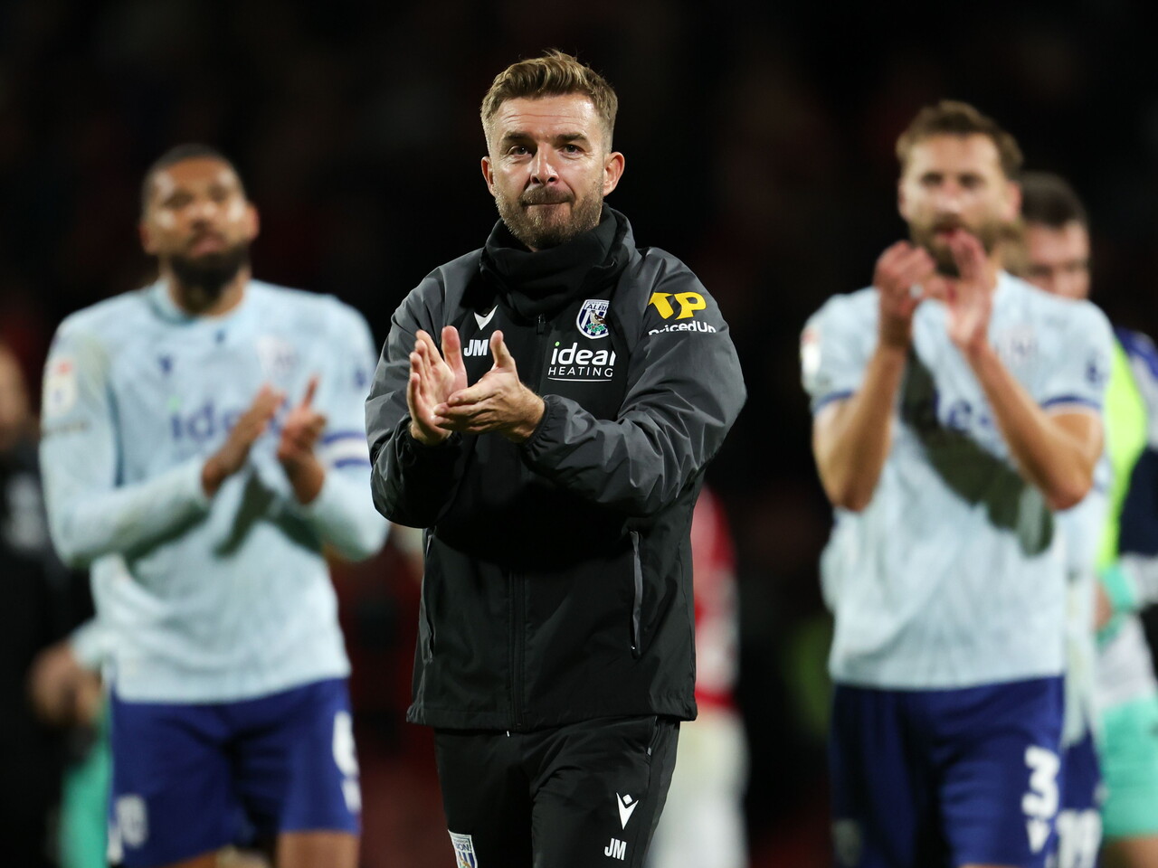 James Morrison applauds the away fans at full-time