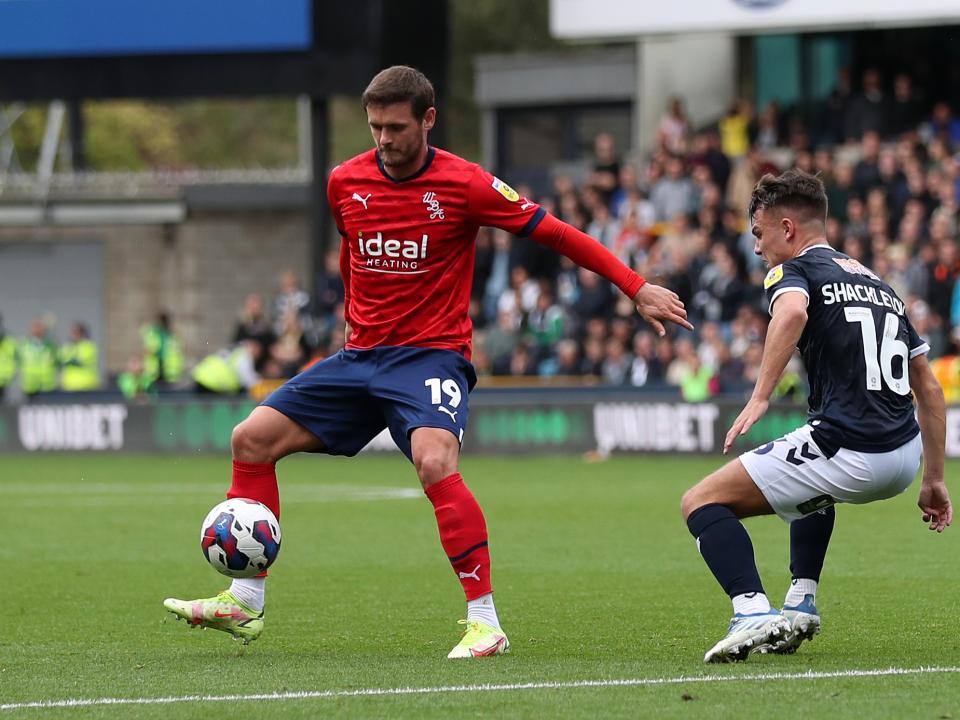 An image of John Swift in action against Millwall