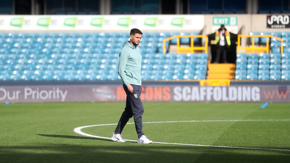 Okay Yokuslu inspects the pitch at the Den