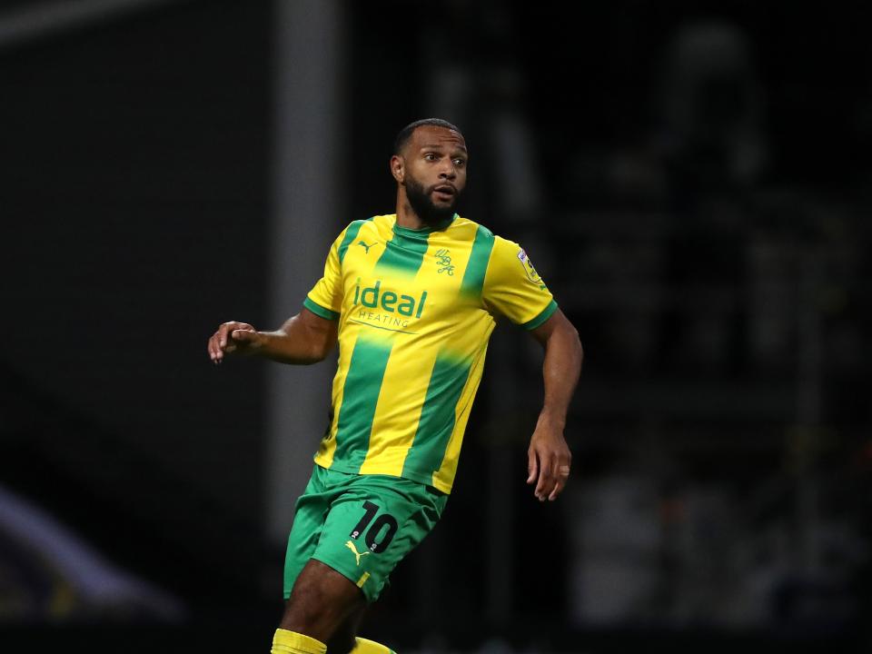 Matt Phillips wearing the green and yellow away kit