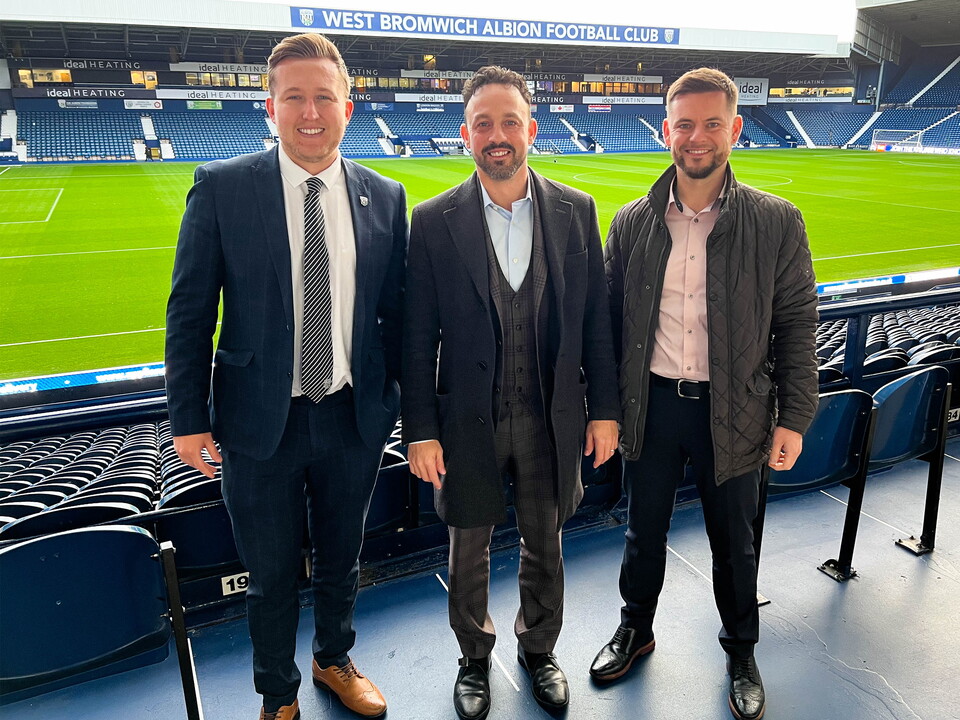 Jon Ward with Matt Holden-Jones & Simon Carswell of HJ Wealth on the East Stand.