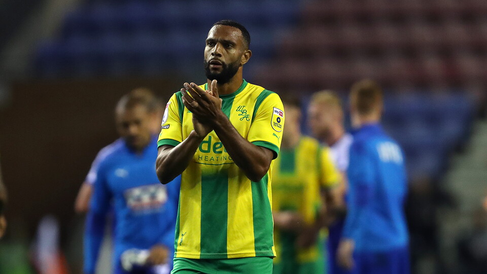 Matty Phillips applauds the Albion fans at full-time against Wigan Athletic