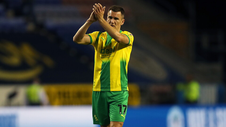 Jed Wallace applauds the Albion travelling faithful at Wigan
