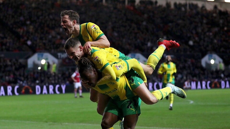 Brandon Thomas-Asante is mobbed by Conor Townsend and Jayson Molumby after making it 2-0 against Bristol City