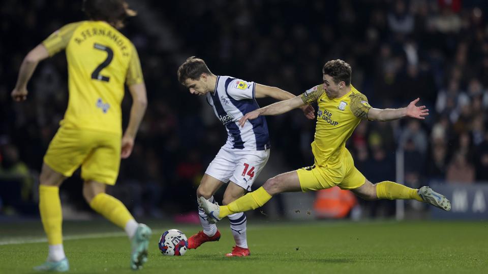 An image of Jayson Molumby being tackled against Preston