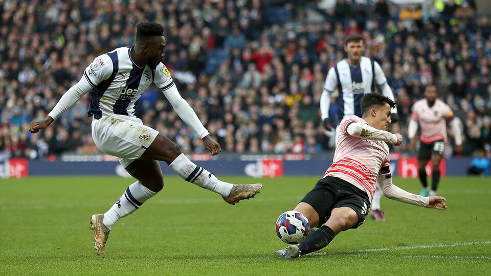 Daryl Dike fires a shot at goal for Albion v Reading