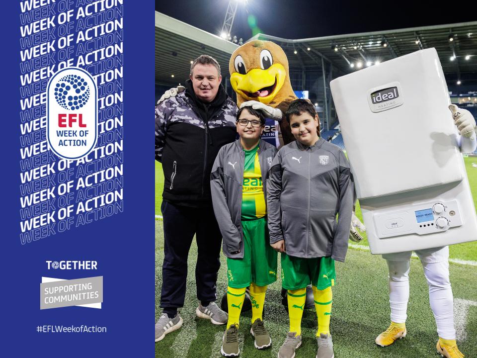 James, Richard & Dad standing with Baggie Bird and Boiler Man pitch side.