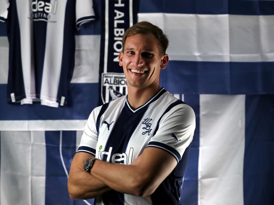 Marc Albrighton posing in a WBA shirt