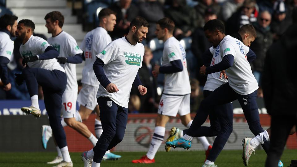An image of the players warming up against Middlesbrough