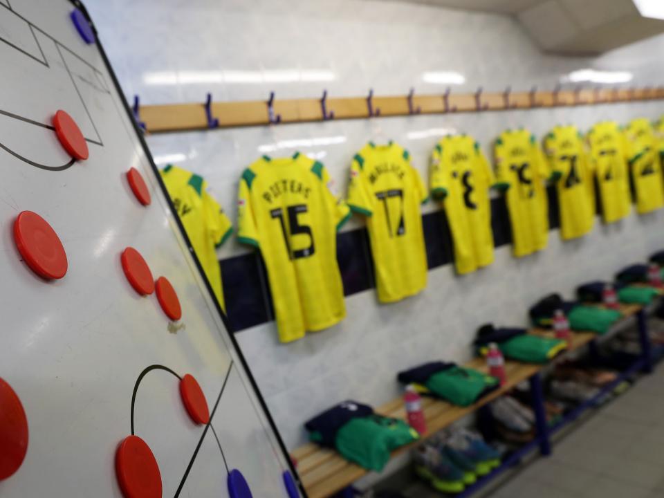 Albion away shirts hanging up next to a tactics board from a previous game