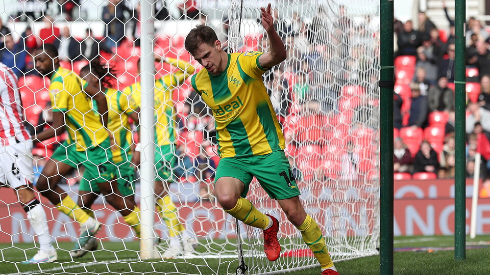 Jayson Molumby celebrates putting Albion ahead v Stoke City
