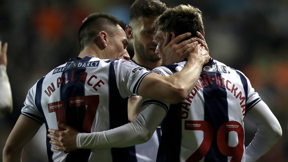 A photo of Jed Wallace congratulating Taylor Gardner-Hickman after scoring Albion's second goal v Blackpool