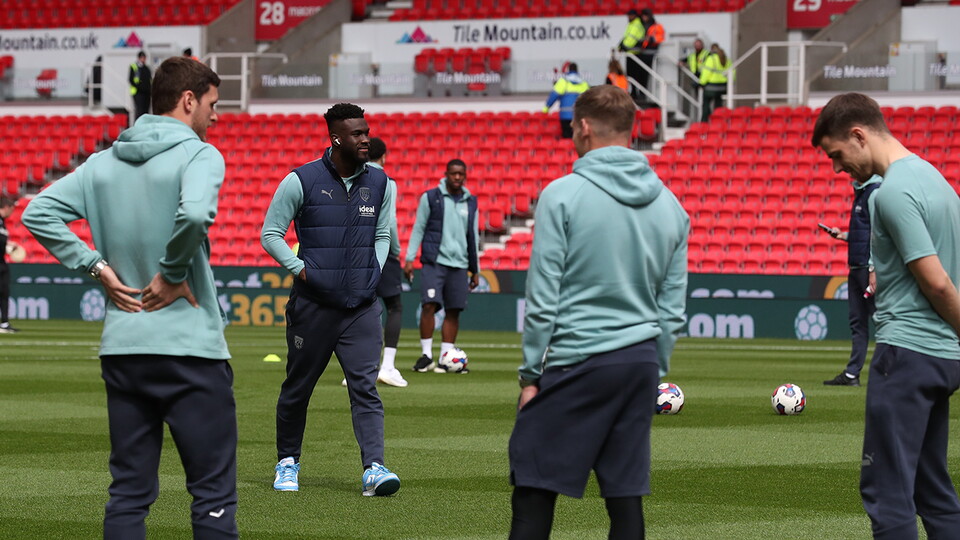 Daryl Dike inspects the pitch at the bet365 Stadium