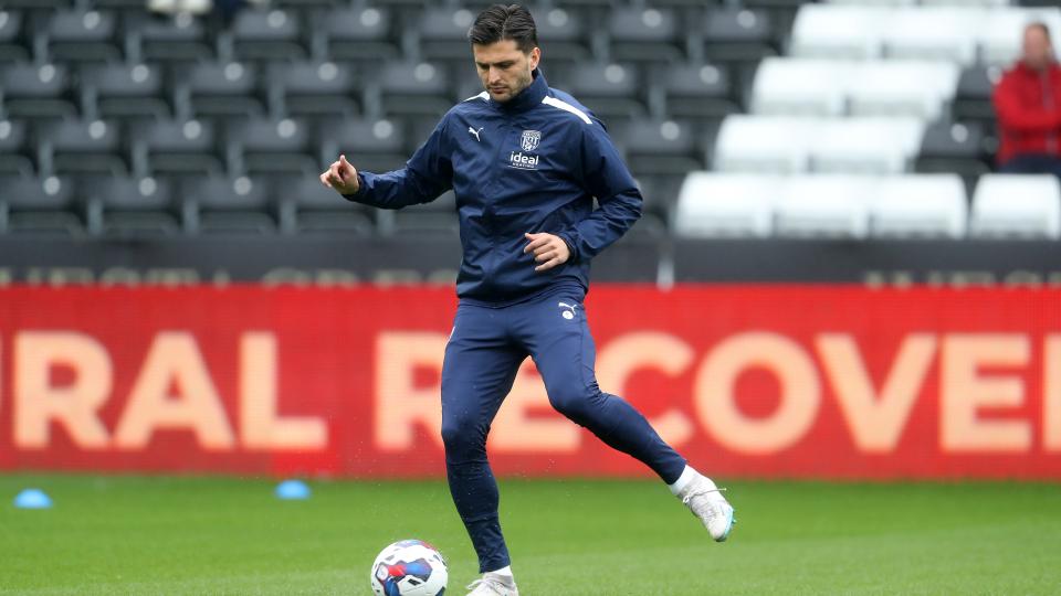 An image of Okay Yokuslu warming up in Swansea