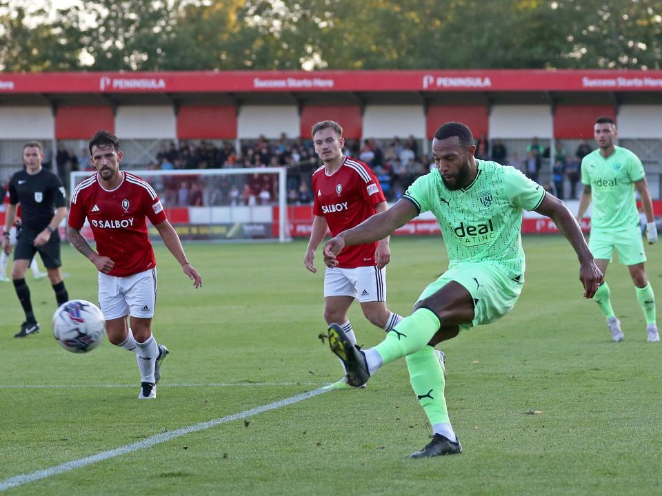 Matt Phillips crosses the ball against Salford City